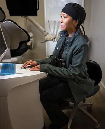 Clinician reviewing digital imaging at the treatment planning workstation