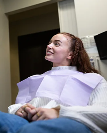 Patient smiling in the treatment chair during a visit at Signature Smiles Studio in Decatur, GA