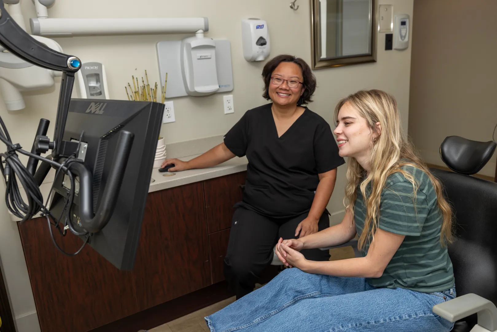 A consultation inside the Signature Smiles Studio dental office in Decatur GA
