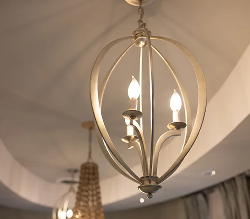 Pendant and beaded chandeliers over the curved reception ceiling